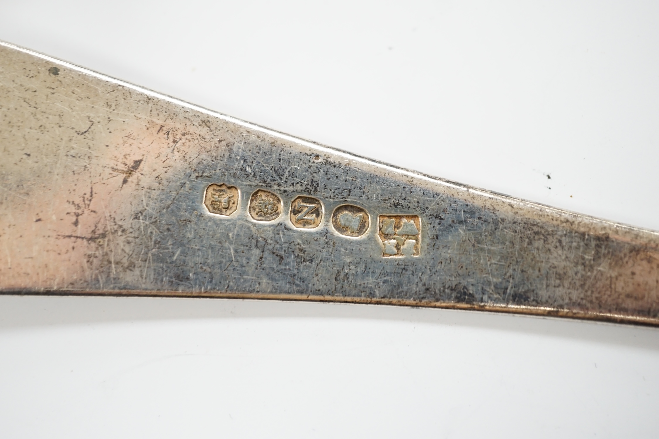 An Edwardian silver Old English pattern soup ladle, London, 1902 and a George III basting spoon, London, 1808, 12.8oz.